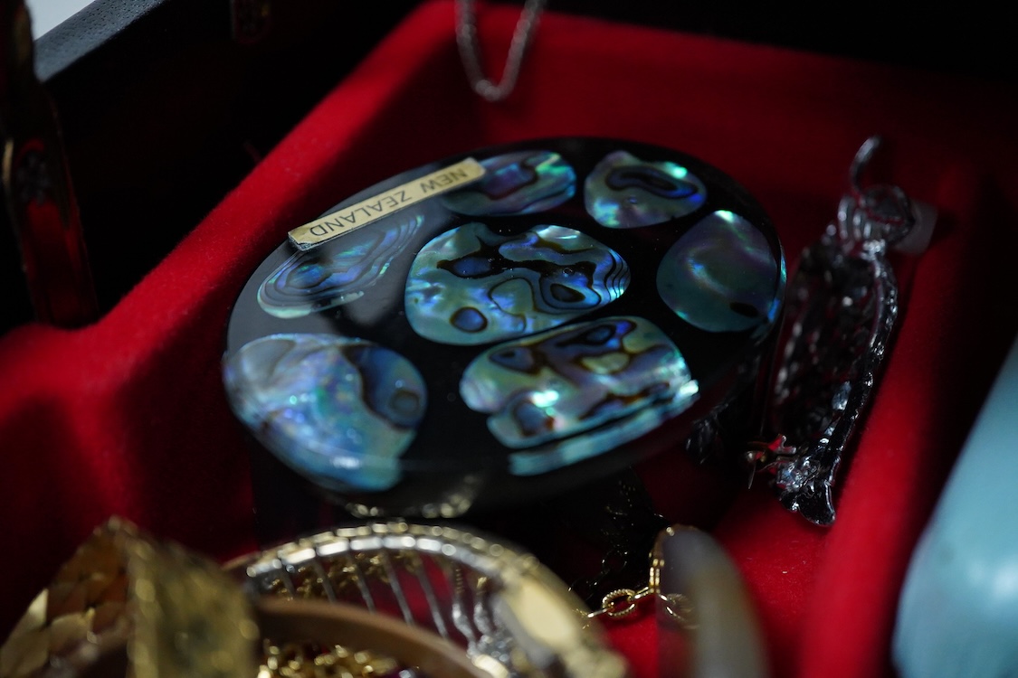 A jewellery box and contents to include a 935 white metal and paste set swallow brooch, silver locket on chain, white metal and costume jewellery, agate necklace and wrist watches including Seiko, Lanco, Lorus and Rotary
